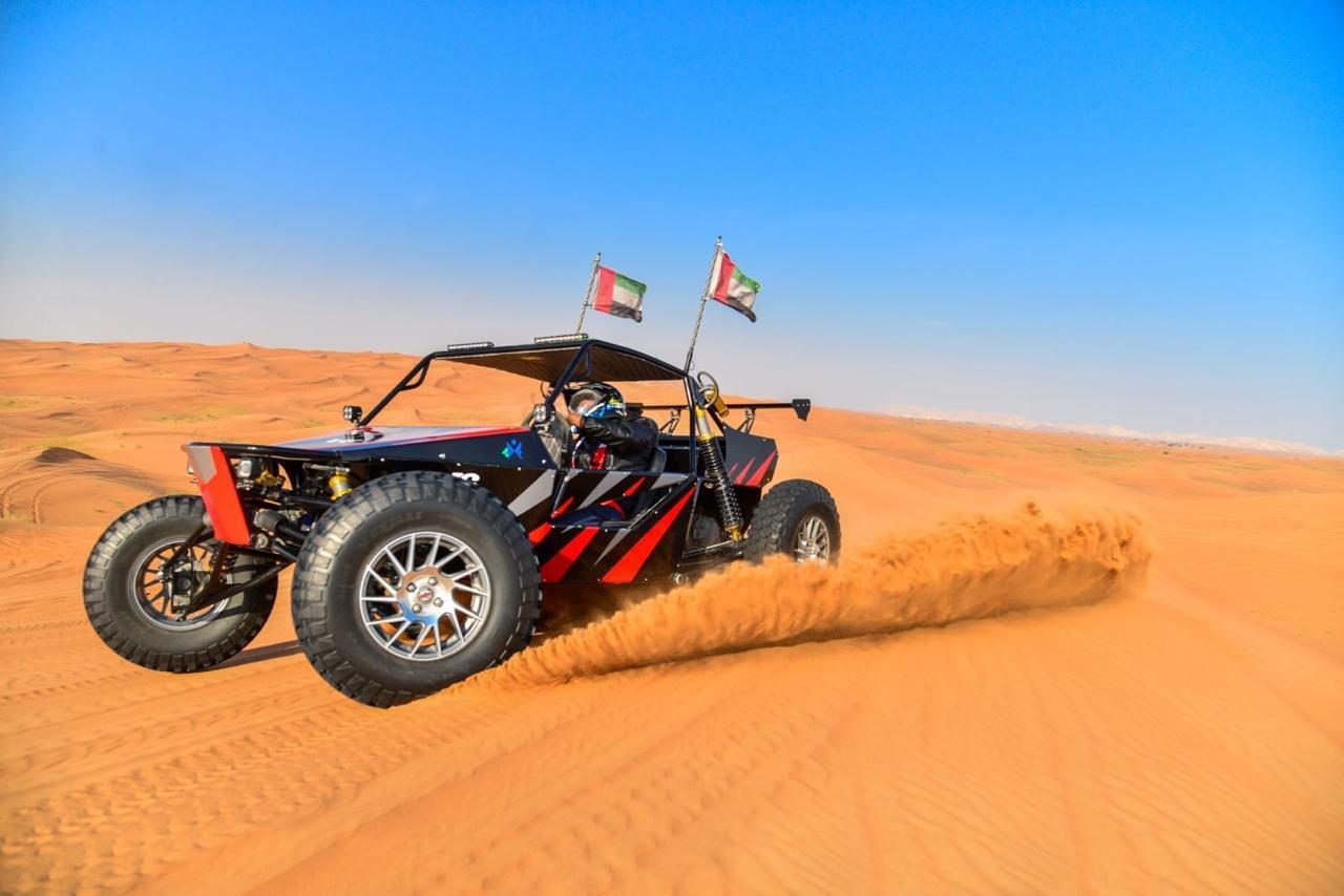 Desert buggy kicking up sand